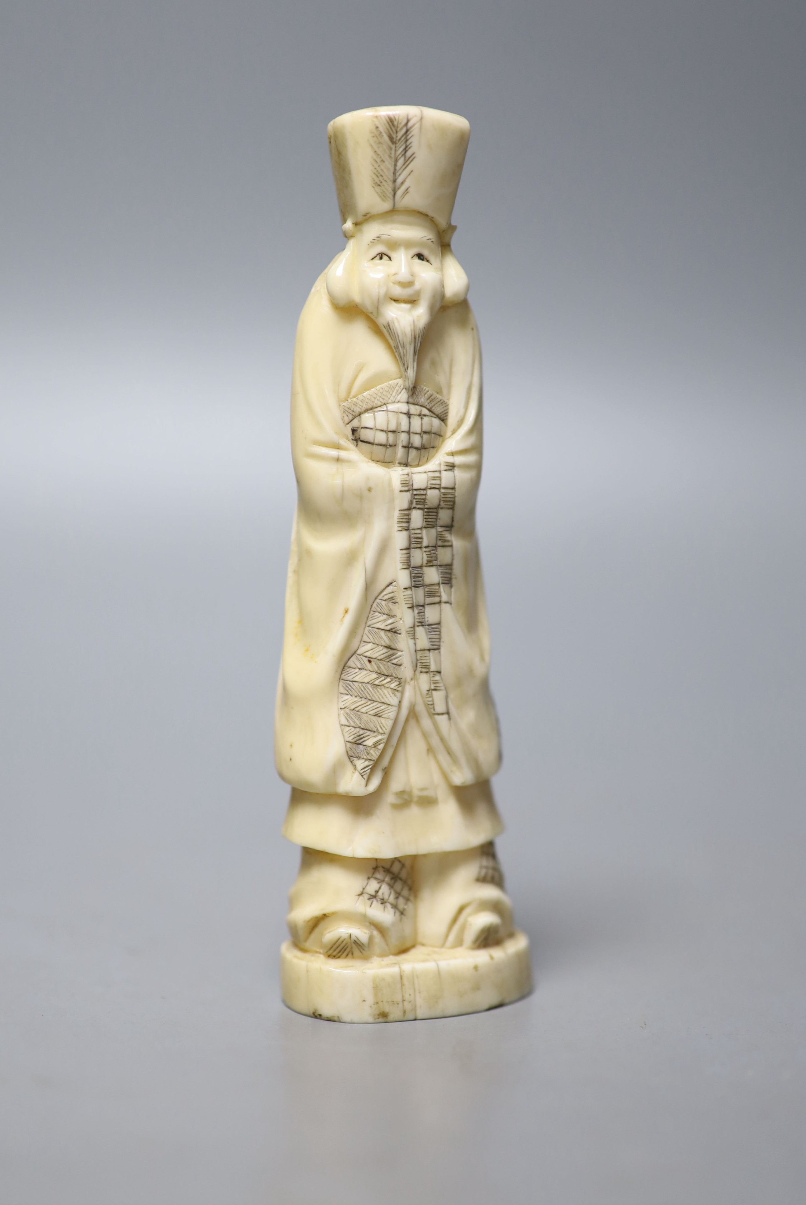 A Japanese walrus ivory figure of an immortal, early 20th century, 13cm